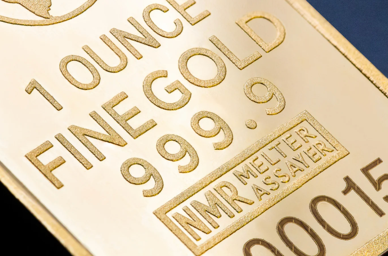 Image of a gold bar with the words 1 ounce fine gold 999.9