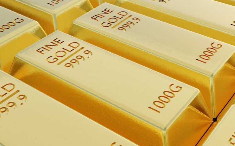 Image of gold bars lined up on a table