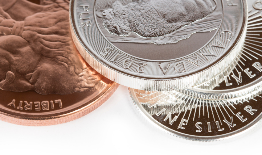 Image of three coins that are made of precious metals