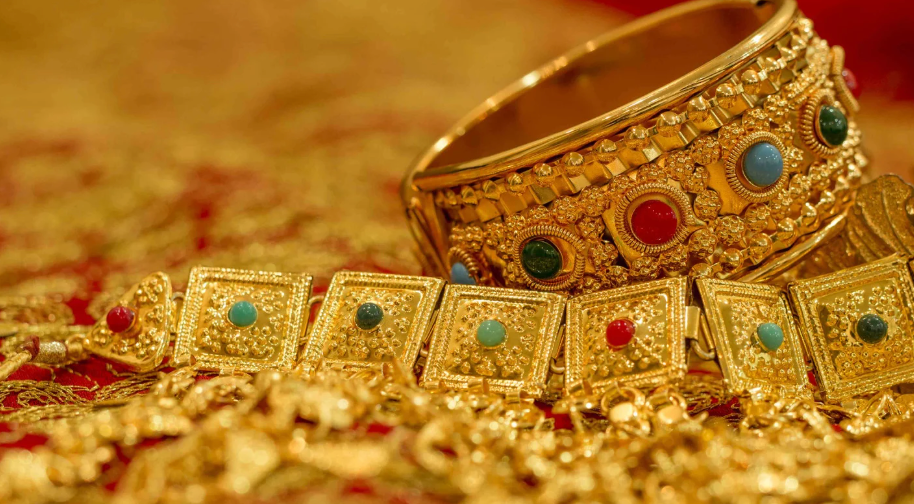 Image of gold jewelry with gemstones