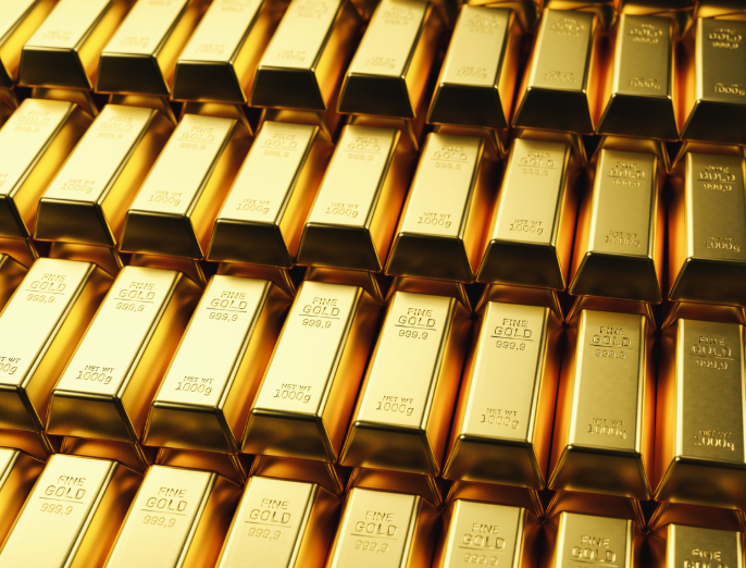 Several gold bars lined up on a surface