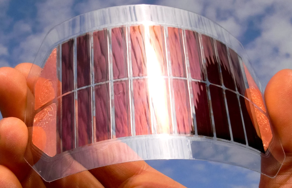 Image of a man holding a small panel of ruthenium