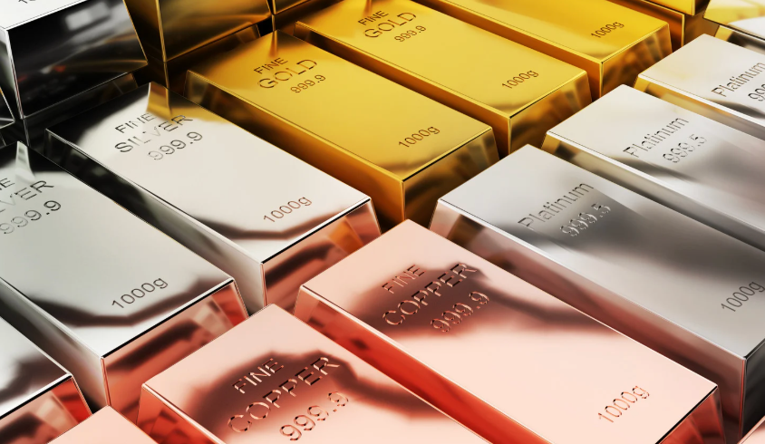close up of gold, silver, copper, and platinum bars lined up
